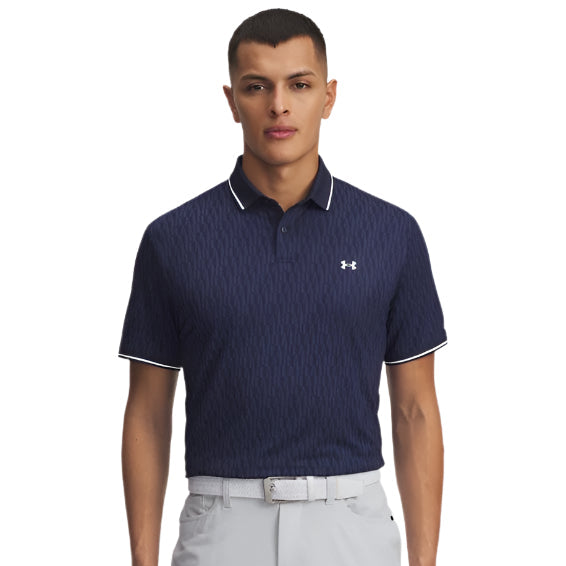 Man wearing a navy patterned polo shirt with white accents on a light gray background