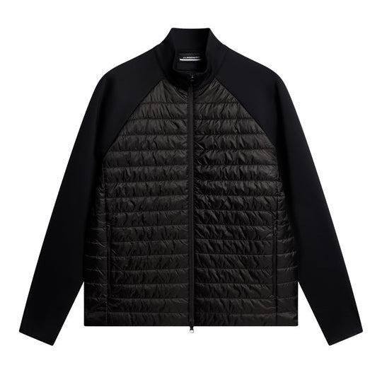 Black quilted jacket on a white background