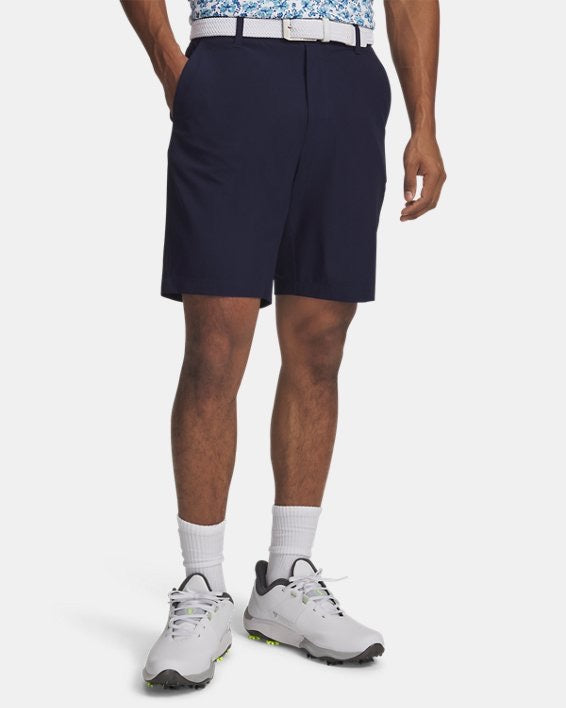 Model wearing Navy Under Armour Golf Shorts, view of the model from the waist down on a white background