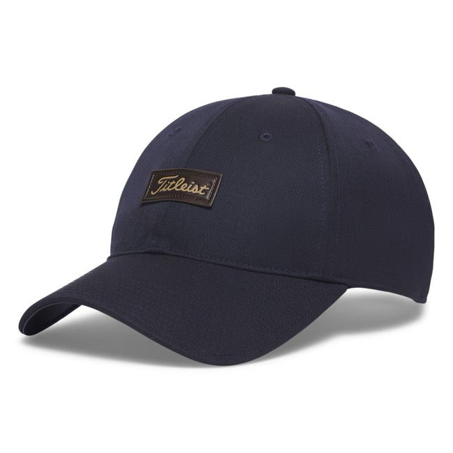 Titleist Birthplace of Golf Charleston navy merino wool cap with a noble brown leather patch, front view.