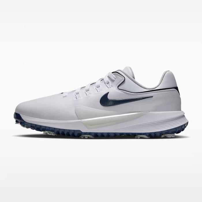 Nike Victory Pro 4 golf shoes in white and midnight navy, side view showing synthetic upper and spiked sole.