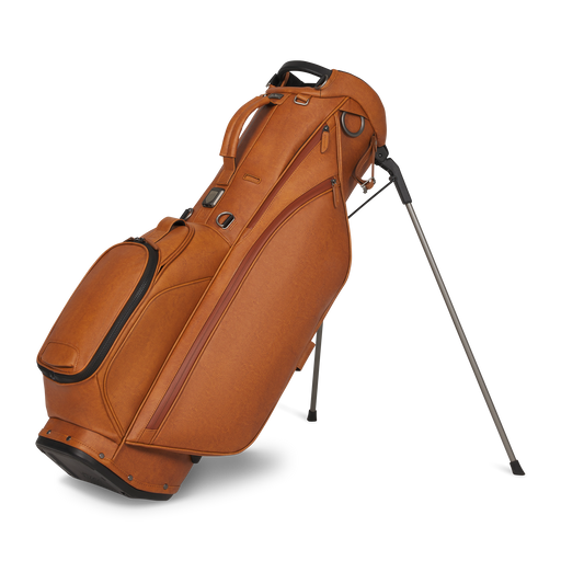 A brown leather golf Titleist LINKSLEGEND Classic Members II Golf Stand Bag with black trim and a silver metal stand leg, shown on a clean white background.