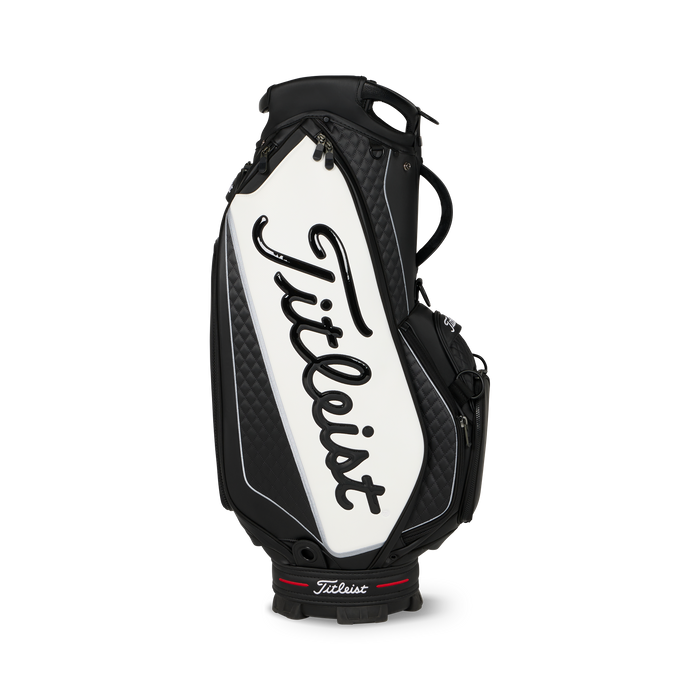 A Titleist Tour Series Tour Golf Bag II in black and white, featuring a large white front panel with the black Titleist logo script, set against a plain white background.