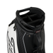 Close-up of a black and white Titleist Tour Series Tour Golf Bag II showing the top handle, padded interior, zipper, and a small red Titleist logo badge.