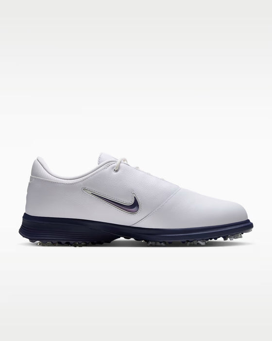Nike Victory Tour 4 golf shoe in white leather with a navy blue midsole and side swoosh, side view.