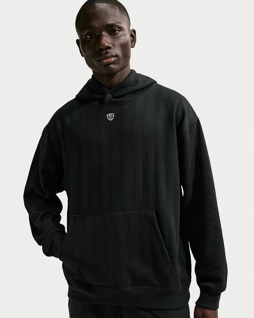 Front view of a black Nike Fairway Fresh oversized golf hoodie with vertical ribbed texture and a small chest logo.