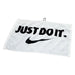 Nike Performance Golf Towel 2.0 in white, featuring a black Just Do It slogan and Swoosh logo with a metal attachment hook.