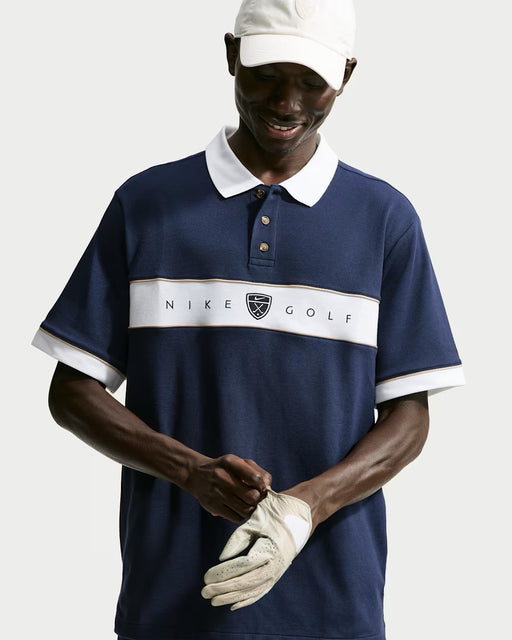 Nike Fairway Fresh men's navy, white, and limestone golf polo shirt with a button placket and chest logo, front view.