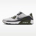 Side view of Nike Air Max 90 golf shoes in white, medium olive, and grey with a metallic silver swoosh.