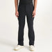 Front view of black PING AquaDrive Pro waterproof golf over trousers with a zip fly and belt loops.