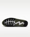 Nike Air Max 90 Golf shoes showing the black, olive green, and white textured rubber traction outsole from below.
