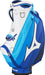 Mizuno Tour Staff golf bag in white and blue, featuring a side view with branded logo, zip pockets and durable finish.