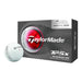 TaylorMade TP5x Performance Stripe golf ball with alignment markings next to a black half dozen box packaging.