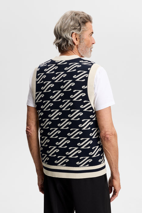 J.Lindeberg Anton Jacquard Knitted Vest in navy with beige JL pattern on male model facing away