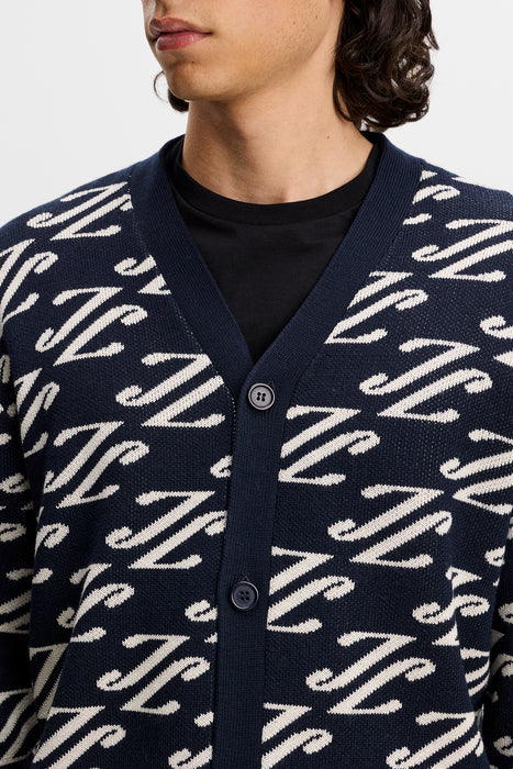 close up on model of the J.Lindeberg Denny Jacquard Knitted Cardigan in navy