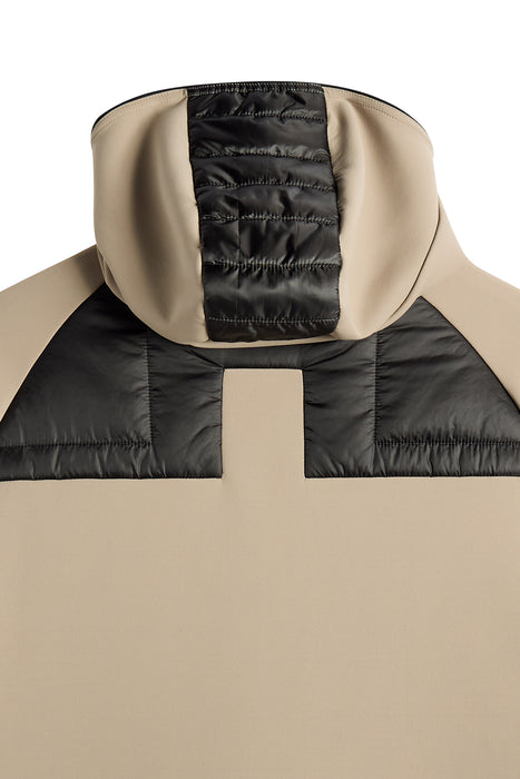 the hood on the J.Lindeberg Heyden Quilt Hybrid Hood Golf Jacket in beige