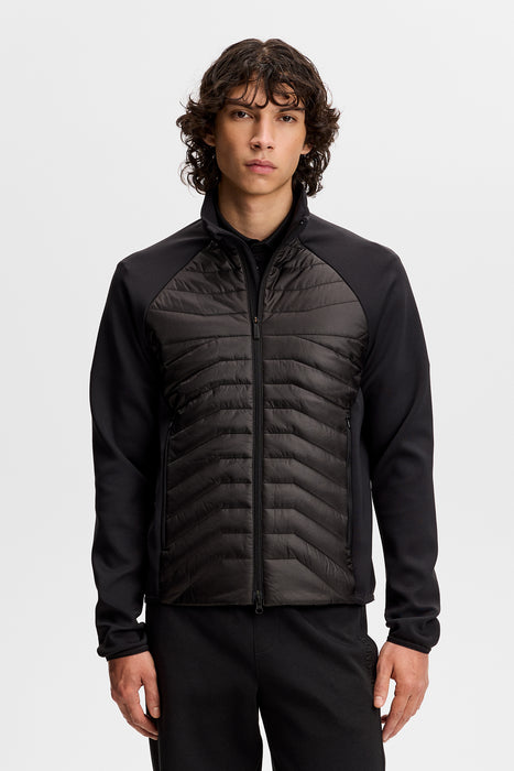 J.Lindeberg Heyden Quilt Hybrid Golf Jacket in black on front facing model
