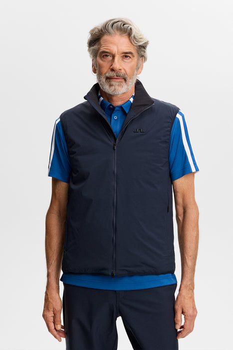 J.Lindeberg Clinton Padded Golf Vest in navy on male model