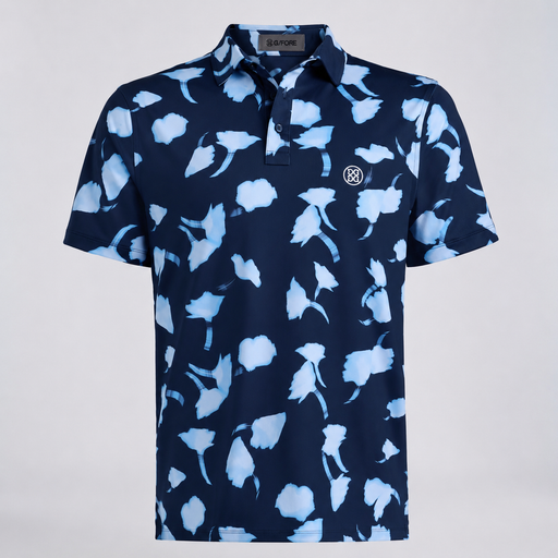 A short-sleeve G/FORE Ghost Floral Tech Jersey Men's Golf Polo Shirt, featuring a navy blue base with a light blue abstract floral pattern. The shirt has a three-button placket and a small circular embroidered logo on the left chest.