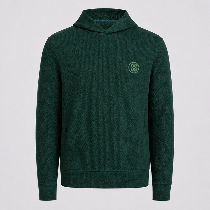 A dark green textured waffle-knit G/FORE Pebble Quilted Men's Golf Hoodie with a small circular embroidered logo on the left chest, displayed on a neutral light grey background.