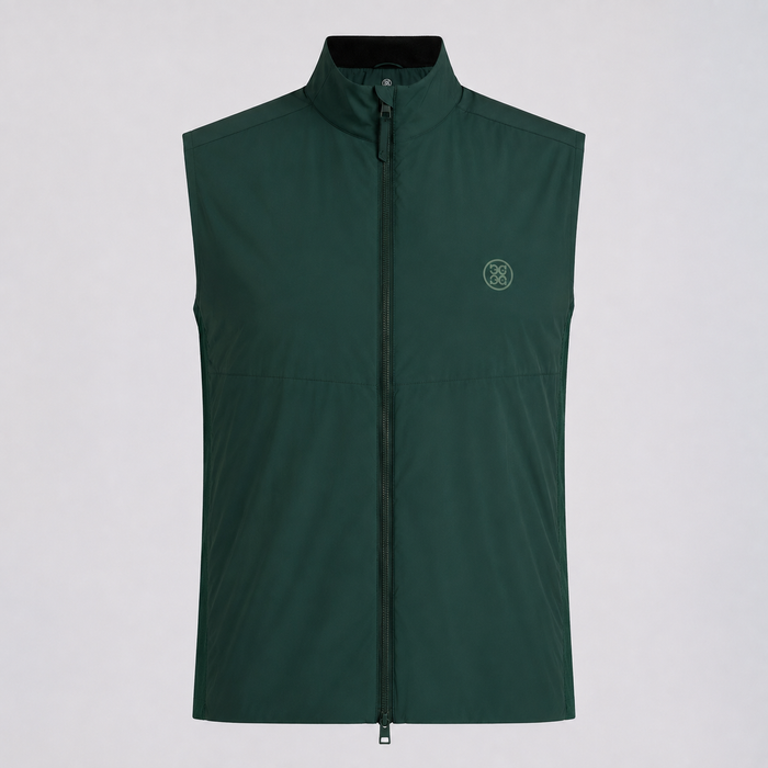 A dark green G/FORE The Maverick Hybrid Stretch 2.0 Men's Golf Gilet with a stand-up collar and a small circular logo on the left chest, displayed against a light grey background.