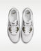 Top-down view of white and olive green Nike Air Max 90 Golf shoes with mesh uppers and lace-up fastening.