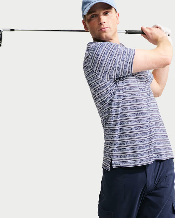 Nike Par Men's Dri-FIT striped golf polo in blue and white, shown from the side during a golf swing.