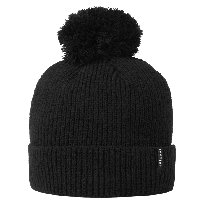 FootJoy Cuffed Golf Bobble Hat in black, featuring a ribbed knit design, a large pom-pom, and a side logo tab.