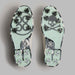 G/FORE Gallivanter G/LOCK Camo Sole Golf Shoes in white with charcoal camo. view of the underneath of the pair