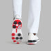 G/FORE Gallivan2R Camo Welt Spikeless Golf Shoes in white with camo welt, view of the multi coloured sole on a model