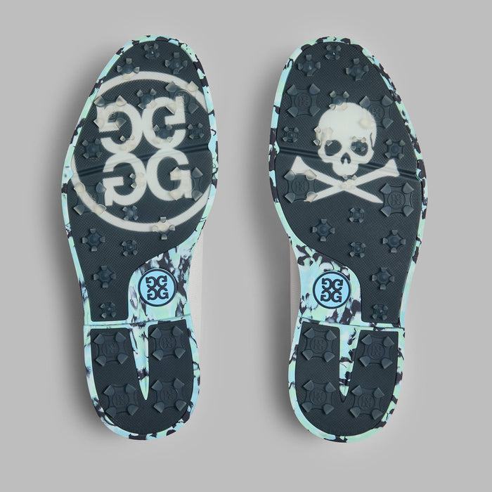 G/FORE Gallivanter Camo Sole Leather Spikeless Golf Shoes in white and blue camo. View of the pair from below