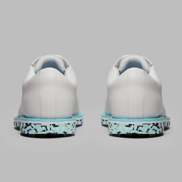 G/FORE Gallivanter Camo Sole Leather Spikeless Golf Shoes in white and blue camo. view of the heels of both shoes