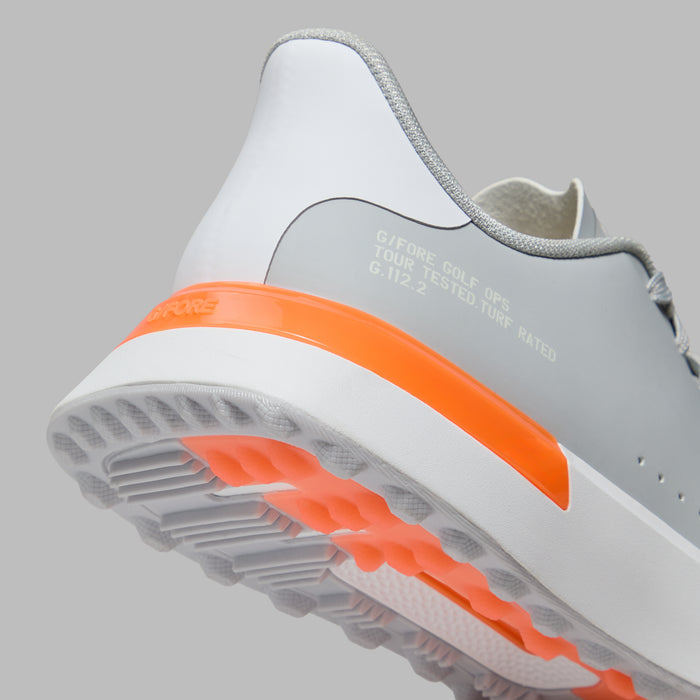 G/FORE G.112 Spikeless Golf Shoes in grey with orange and white detailing, close up of heel