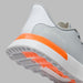 G/FORE G.112 Spikeless Golf Shoes in grey with orange and white detailing, close up of heel