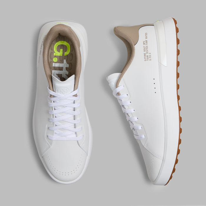 G/FORE G.112 Spikeless Golf Shoes in white and dune beige, view of pair from above with one shoe on its side