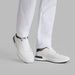G/FORE G.112 Spikeless Golf Shoes in white and navy, view of the pair on a model
