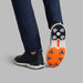 G/FORE Gallivan2r G/LOCK Skull & Tees Golf Shoes in twilight navy, on model with him showing the sole of the right shoe