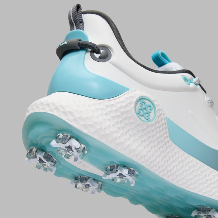 G/FORE MG4+ O2 Gradient G/LOCK Golf Shoes in white and light blue, close up of the heel and sole system