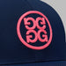 G/FORE Chainstitch Circle G's Contrast Golf Hat in navy. Close up of pink logo