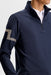 J.Lindeberg Heath Strike Quarter Zip Golf Mid Layer in jl navy on model, close up on jl logo on arm