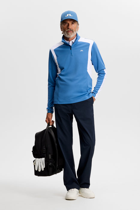 J.Lindeberg Lukas 1/4 Zip Golf Mid Layer in federal blue, on model, full view of outfit