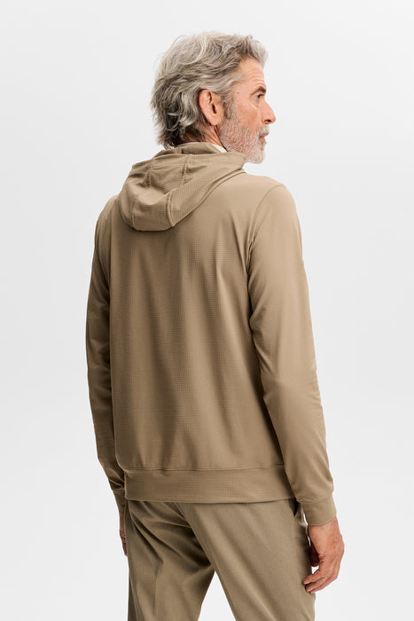 J.Lindeberg Vent Golf Hoodie on male model in brindle beige