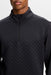 close up on male model wearing the J.Lindeberg Lassy Quarter Zip Golf Mid Layer in black