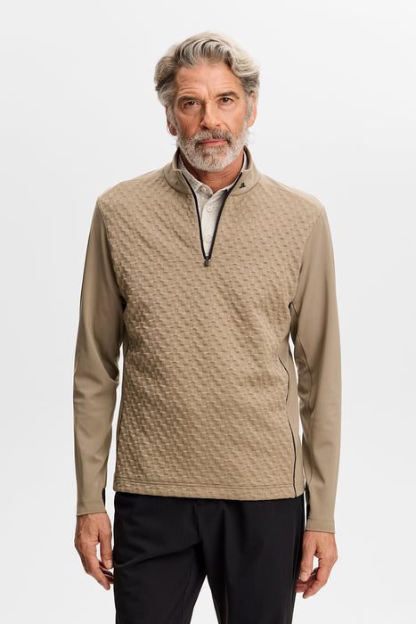 front facing male model wearing J.Lindeberg Lassy Quarter Zip Golf Mid Layer