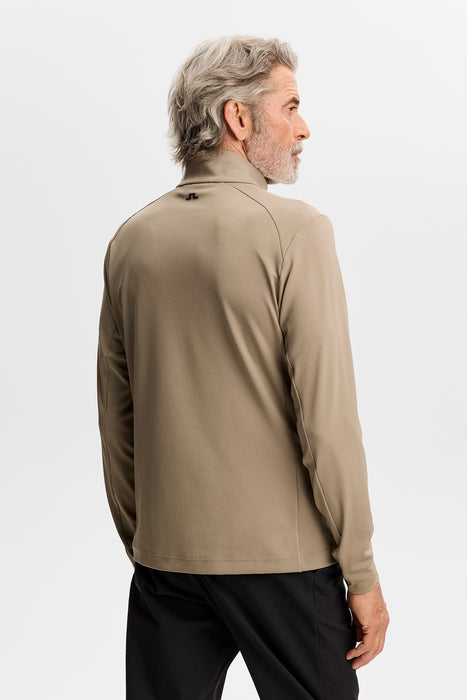 back of the J.Lindeberg Lassy Quarter Zip Golf Mid Layer in beige