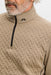 close up on male model of J.Lindeberg Lassy Quarter Zip Golf Mid Layer in beige
