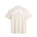 J.Lindeberg KV Golf Polo Shirt in beige, showing the bridge design on the back of the polo