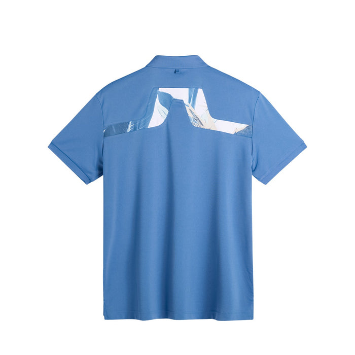J.Lindeberg KV Print Golf Polo Shirt in federal blue, showing the printed bridge logo on back