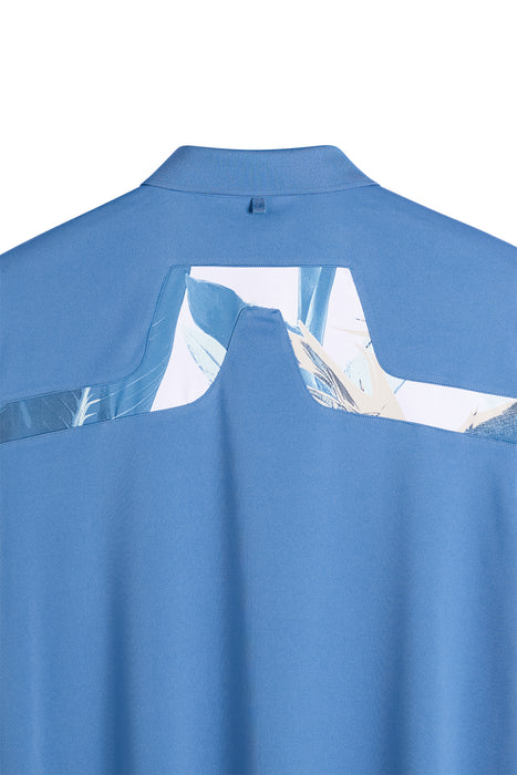 J.Lindeberg KV Print Golf Polo Shirt in federal blue. Close up on bridge logo