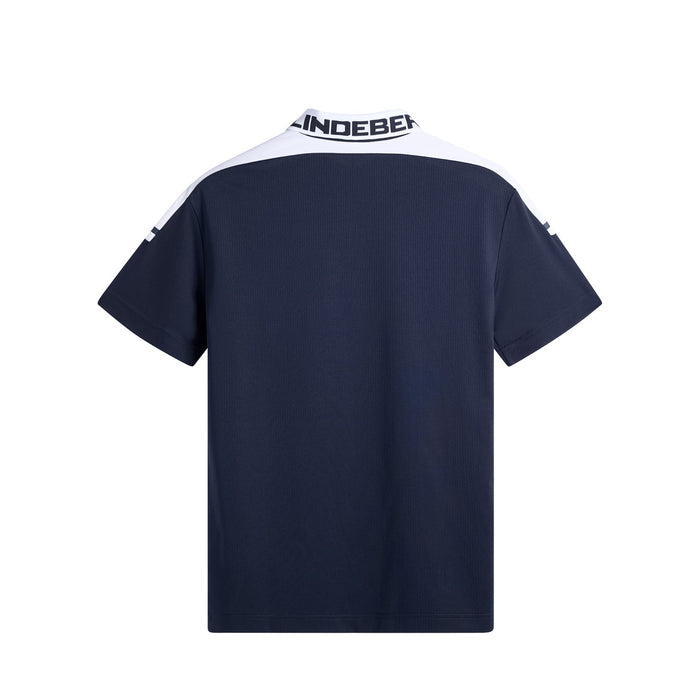 J.Lindeberg Bo Polo Golf Shirt in navy and white. Back view showing the JL logo around the collar